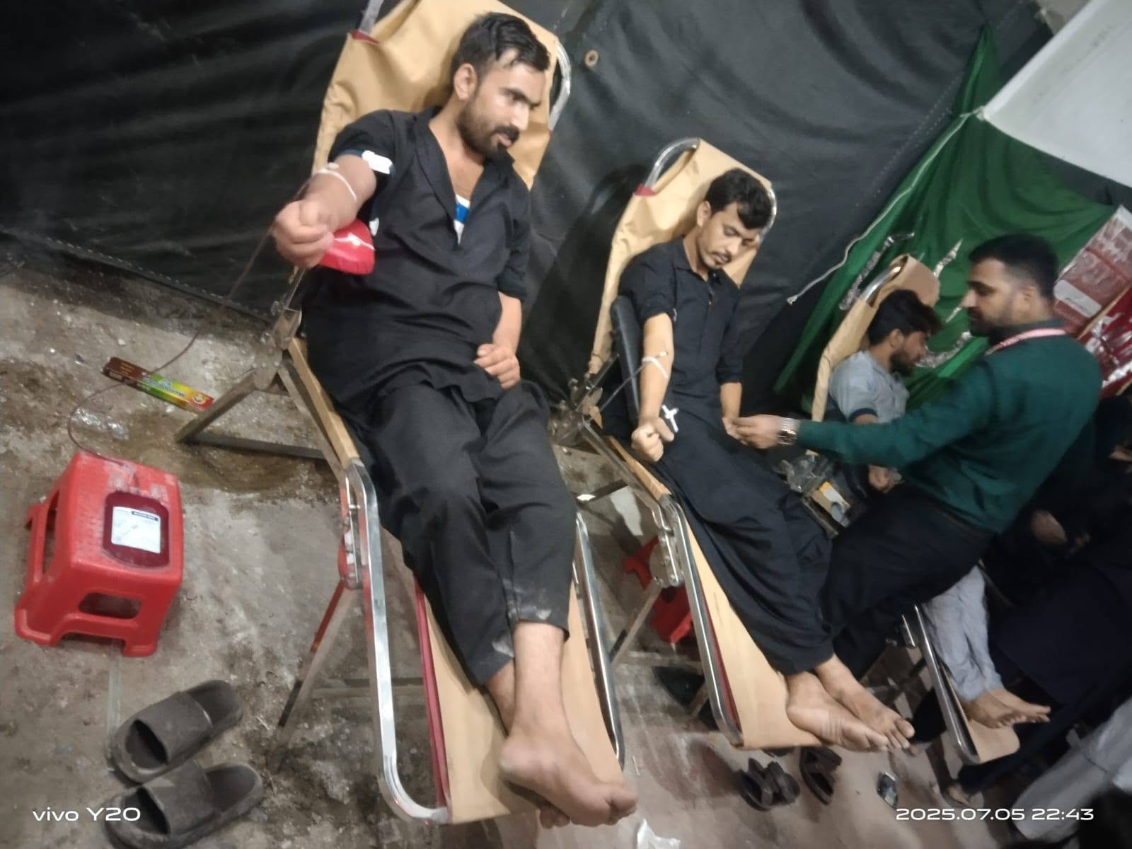 Donors giving blood at a BMT camp during Muharram
