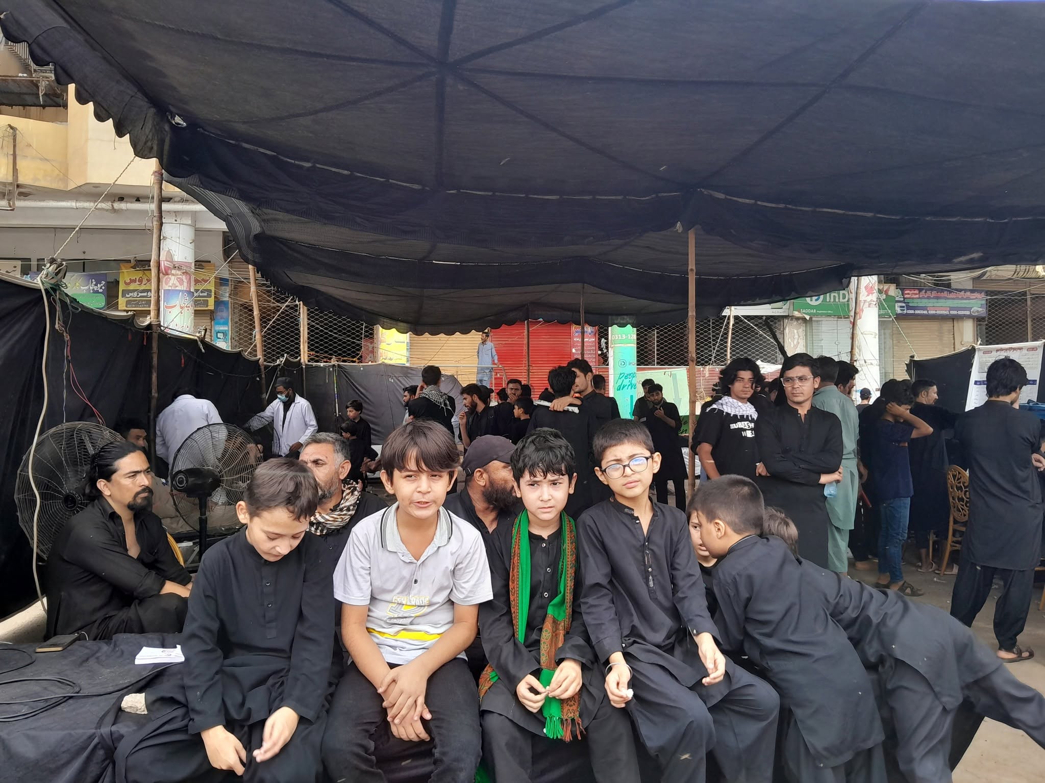 Families at a BMT camp during Muharram