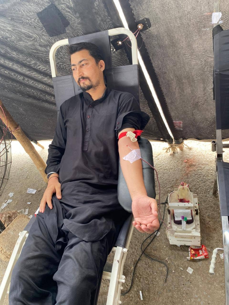 Blood donation in progress at a BMT camp